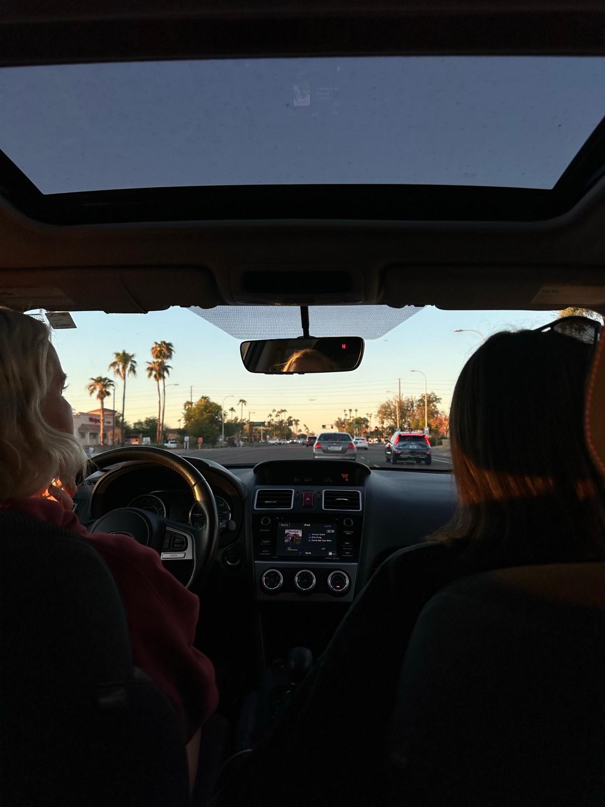 The view forward from inside a car on the drive to campus